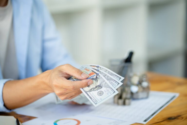 Saving money. Businessman Accountant verify growing business and saving money stacking coins with calculator. Accountancy Concept