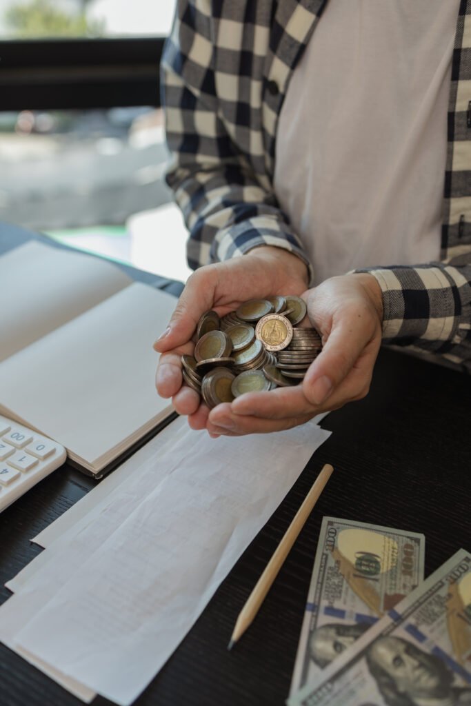 Man holding coins in hand