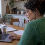 Woman comparing Roth IRA account fees